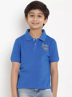 Child wearing a blue polo shirt with a logo on a white background
