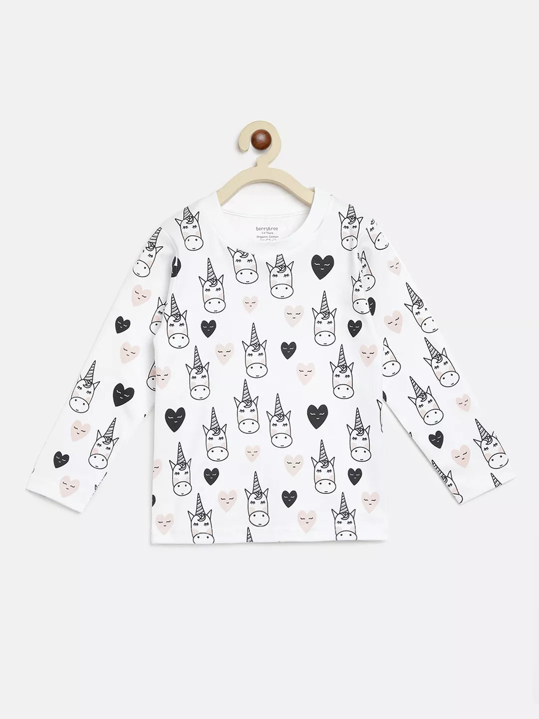 White long-sleeve shirt with black unicorn pattern on a hanger against a white background
