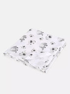 White blanket with black animal prints on a white background