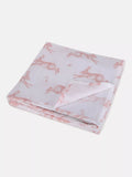 Folded fabric with pink rabbit pattern on a white background