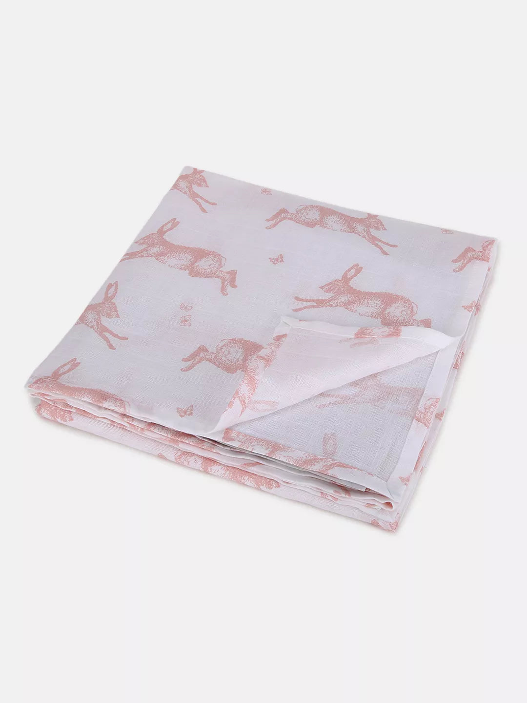 Folded fabric with pink rabbit pattern on a white background