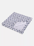 Folded fabric with a blue and white pattern on a white background