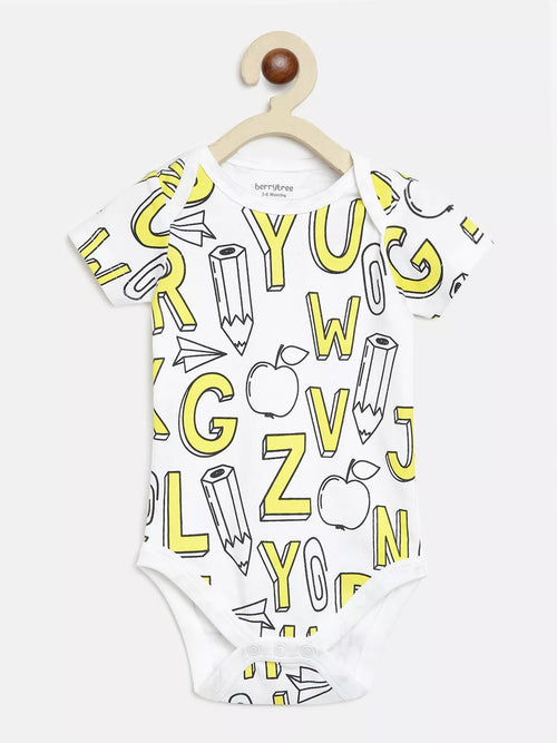 White baby onesie with yellow alphabet and pencil print on a hanger against a white background