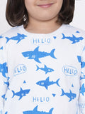 Child wearing a shirt with blue shark and 'HELLO' patterns on a white background