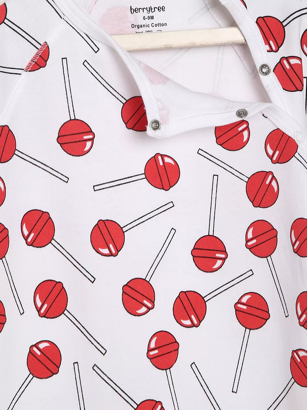White shirt with red lollipop pattern on a white background