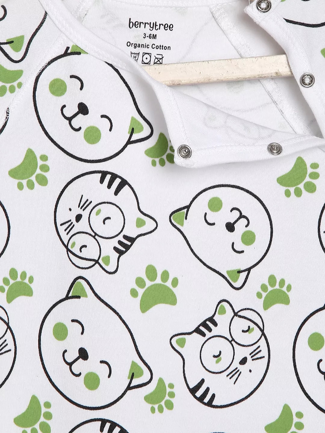 Patterned fabric with cat faces and paw prints on a white background, featuring the brand 'berrytree'.