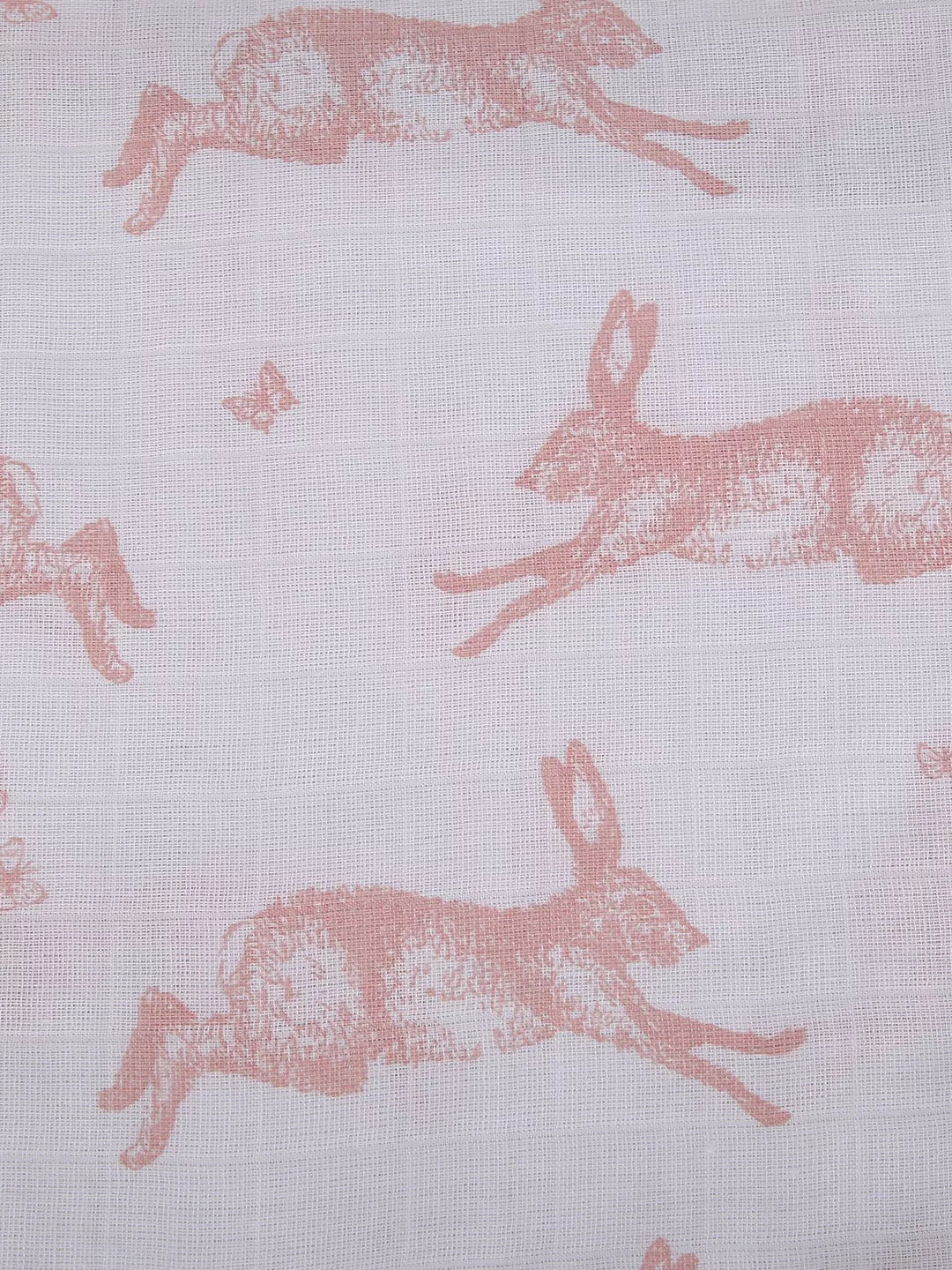 Fabric with pink rabbit pattern on a light gray background