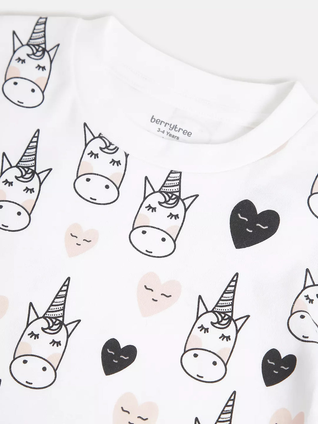White shirt with black and beige unicorn pattern and 'berrytree' branding.