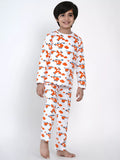 Child wearing a white pajama set with orange helicopter pattern on a white background