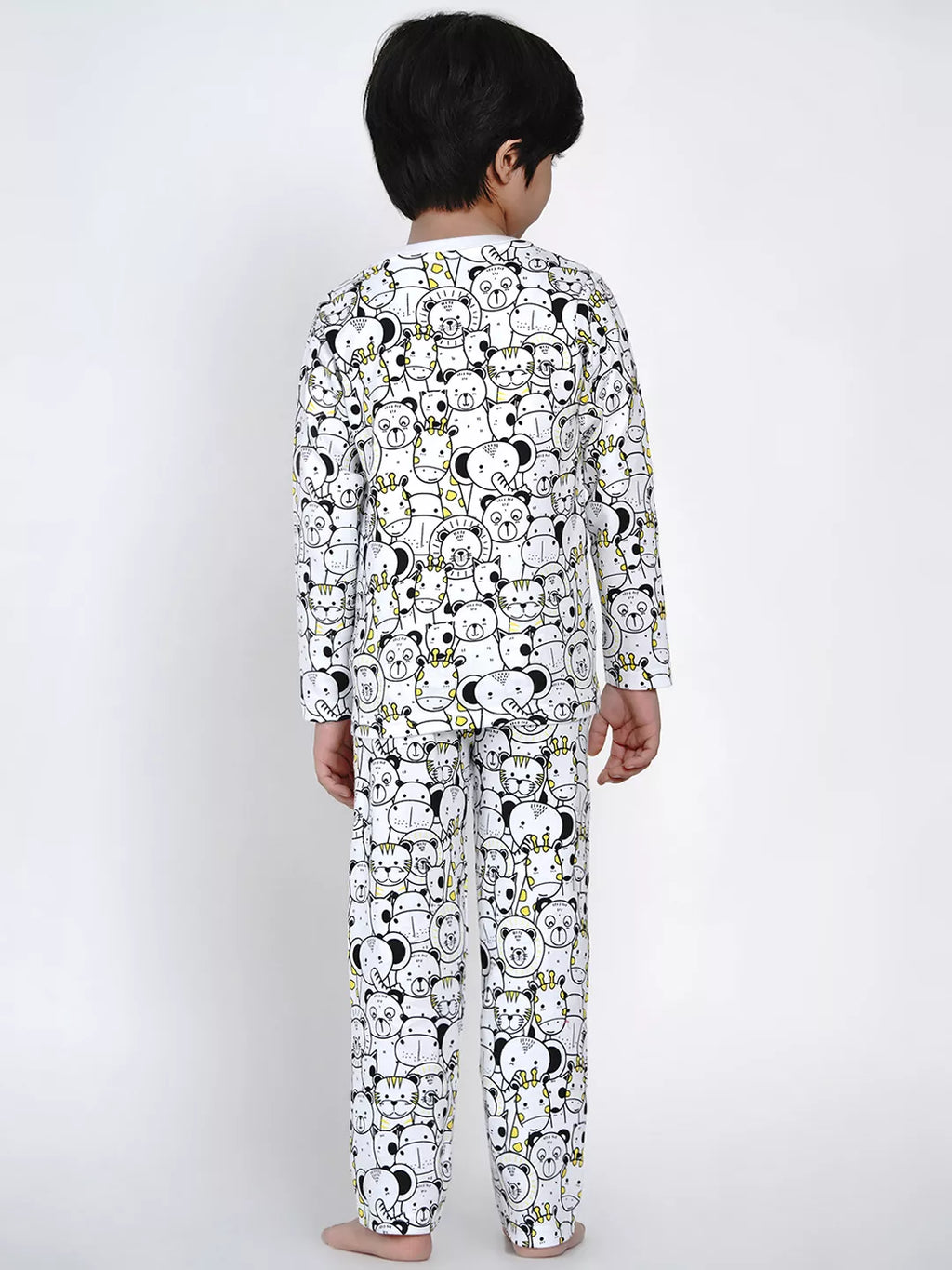 Child wearing a pajama set with cartoon character pattern on a white background