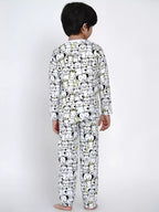 Child wearing a pajama set with cartoon character pattern on a white background