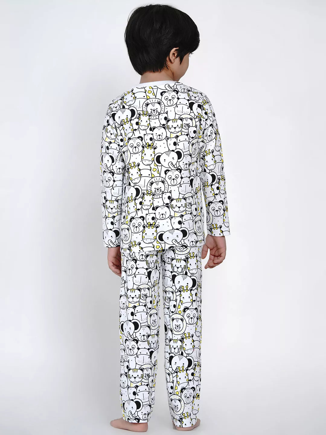 Child wearing a pajama set with cartoon character pattern on a white background