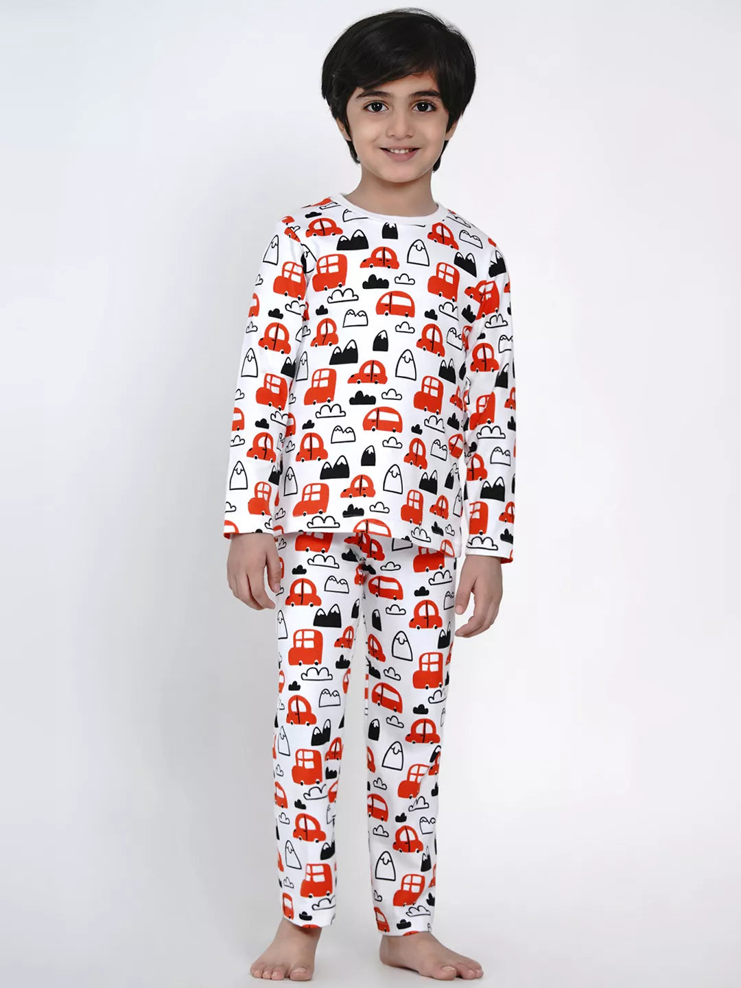 Child wearing a red and black patterned pajama set on a white background