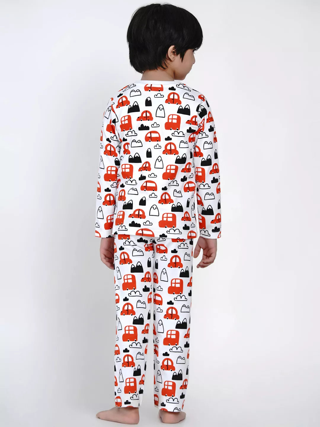 Child wearing pajamas with car pattern on a white background