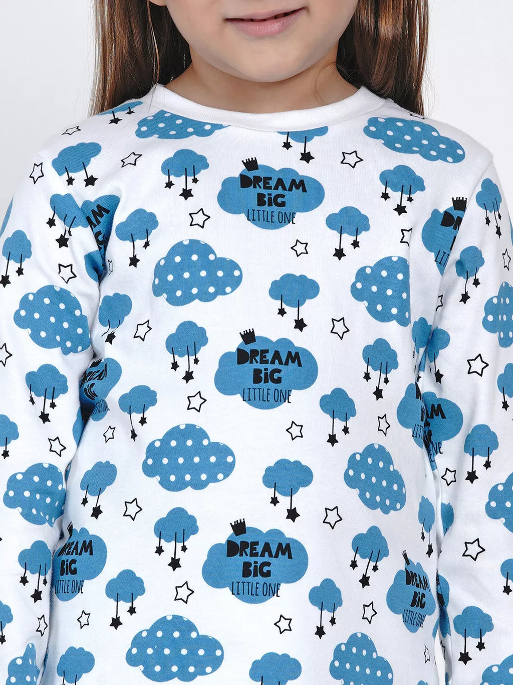 Child wearing a shirt with blue cloud and star pattern