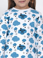 Child wearing a shirt with blue cloud and star pattern
