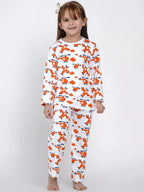 Child wearing a white long-sleeve shirt and pants with orange airplane pattern on a white background