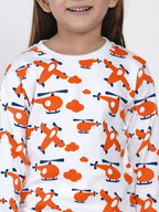 Child wearing a long-sleeve shirt with orange helicopter pattern on a white background