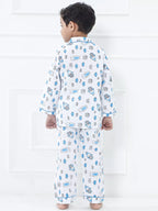 Child wearing a patterned pajama set against a white background