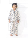 Child wearing zebra-patterned pajamas on a white background