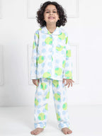 Child wearing a colorful polka dot pajama set against a white background