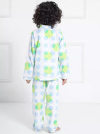 Child wearing a polka dot pajama set with a white background 2